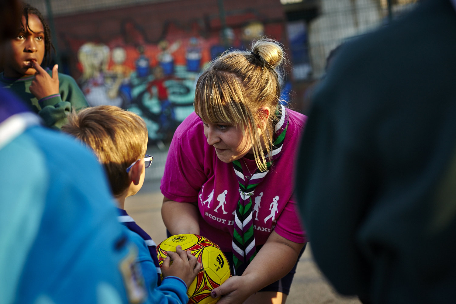 Female leader encouraging Beavers and Cubs